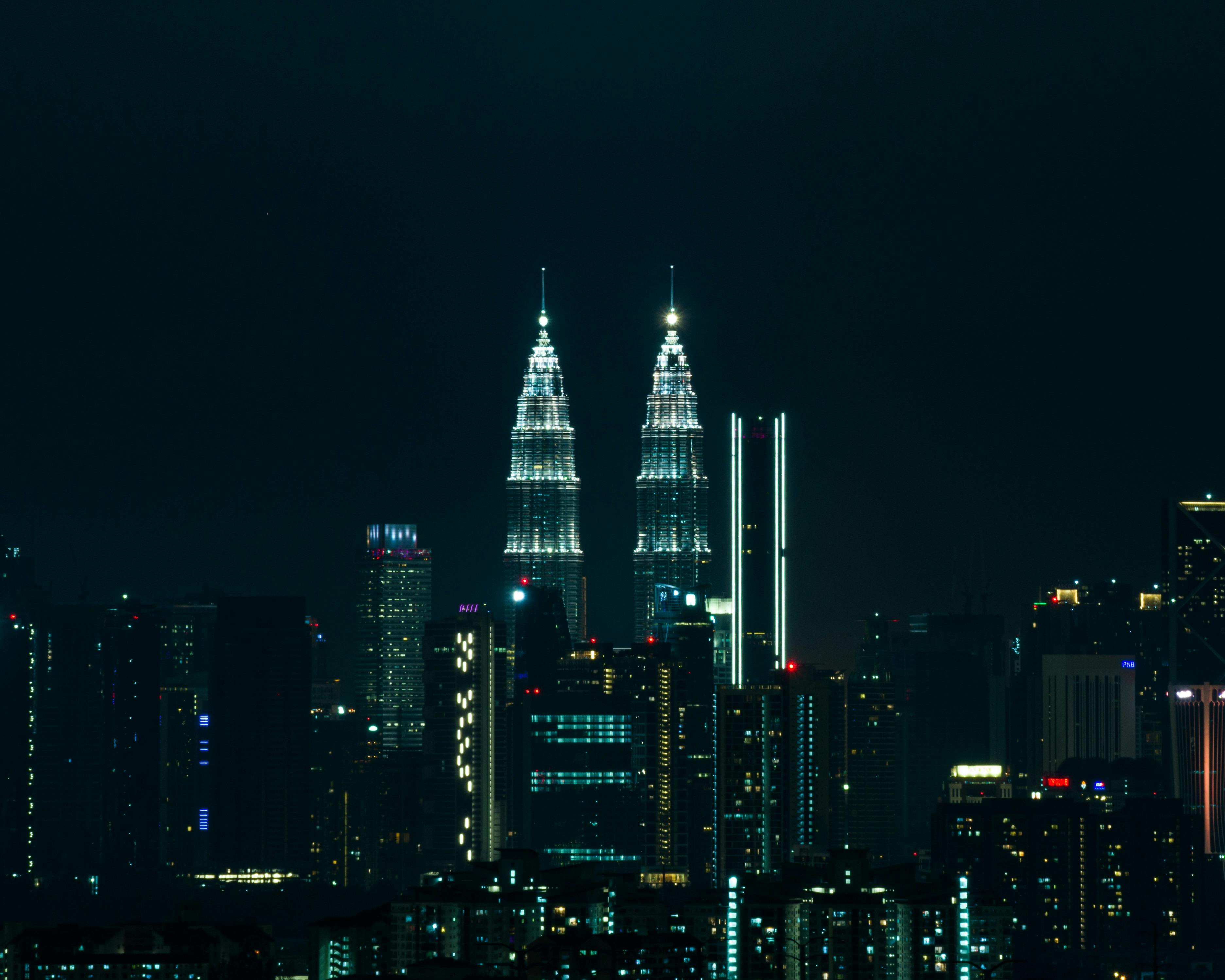 Kuala Lumpur skyline at night with Petronas Towers